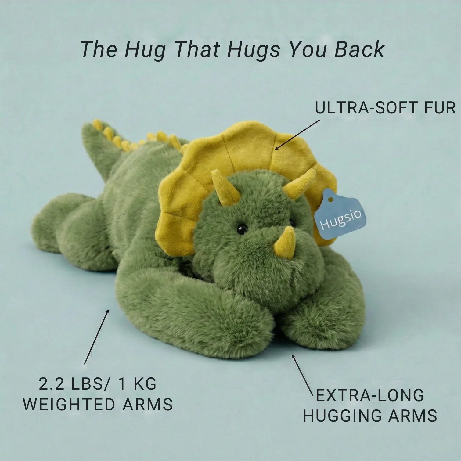 Green plush dinosaur toy with yellow horns on a light blue background, labeled with features and brand name.